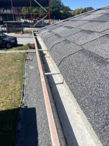 Spotless gutter after professional cleaning, free of debris and leaves.